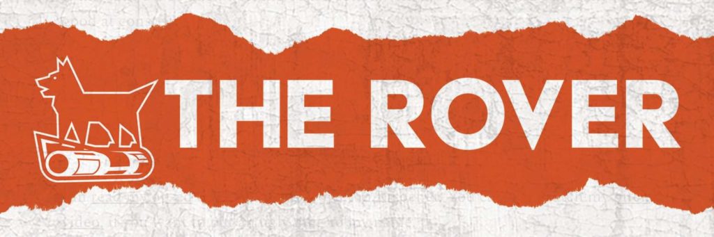 The logo for the Rover, displaying a barking dog on top of a rolled up newspaper.